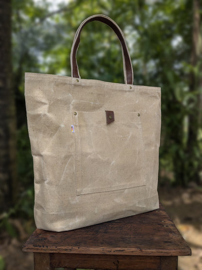 LadyMady waxed canvas tote bag showcasing durable design and stylish leather handles, perfect for everyday use.