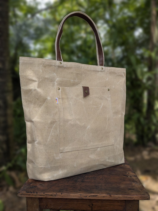 LadyMady waxed canvas tote bag showcasing durable design and stylish leather handles, perfect for everyday use.